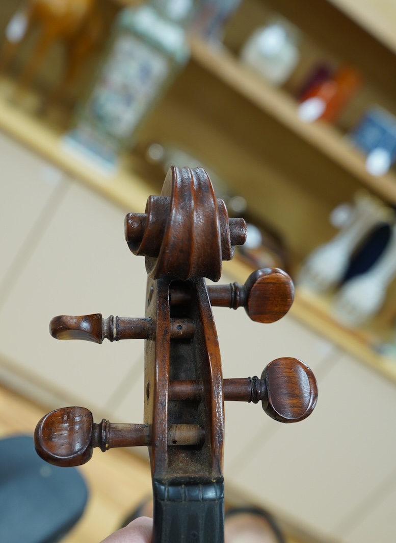 An early 20th century cased Welsh violin, the handwritten label inside the body reads; ‘James Parkinson, Llandudno No.9, 1921’, with a single piece back, inlaid stringing to the edge of the body, length of body 35.5cm, t